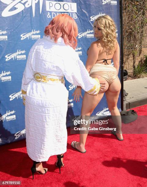 Model Blac Chyna spanks adult film actress Alexis Texas during a pool party hosted by Blac Chyna at Sapphire Pool & Day Club on May 6, 2017 in Las...