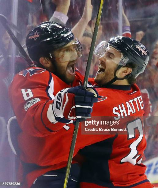 Alex Ovechkin of the Washington Capitals scores at 7:47 of the third period against the Pittsburgh Penguins and is embraced by Kevin Shattenkirk in...