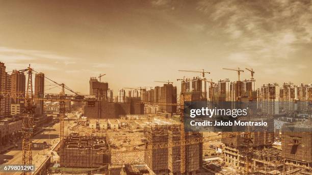 huge construction site in tianjin - jakob montrasio stock pictures, royalty-free photos & images