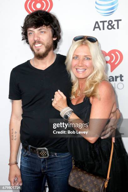 Musician Chris Janson and Kelly Lynn attend the 2017 iHeartCountry Festival, A Music Experience by AT&T at The Frank Erwin Center on May 6, 2017 in...