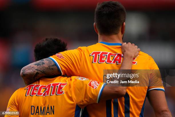 Andre-pierre Gignac of Tigres celebrates with teammate Damian Alvarez after scoring the fifth goal of his team during a match between Queretaro...