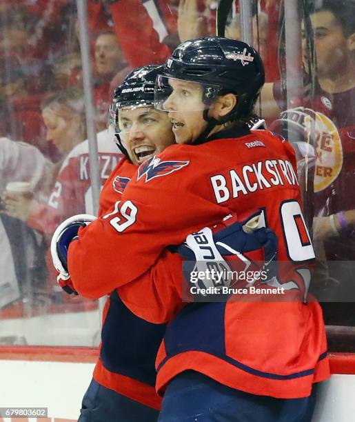 Nicklas Backstrom of the Washington Capitals celebrates his game tying goal against the Pittsburgh Penguins at 2:49 of the third period and is joined...