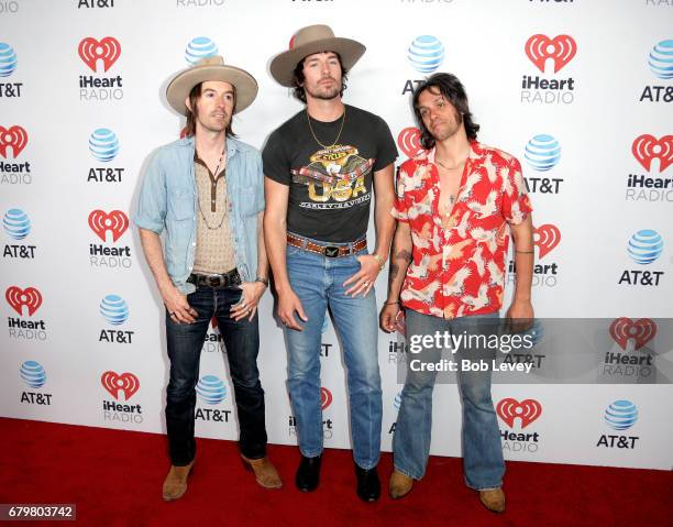 Musicians Jess Carson, Mark Wystrach and Cameron Duddy of Midland attend the 2017 iHeartCountry Festival, A Music Experience by AT&T at The Frank...