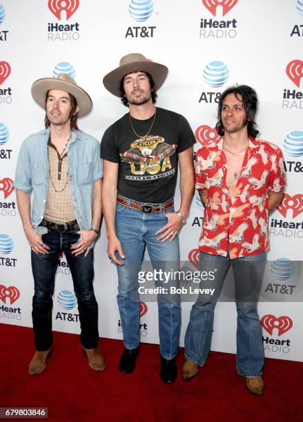 Musicians Jess Carson, Mark Wystrach and Cameron Duddy of Midland attend the 2017 iHeartCountry Festival, A Music Experience by AT&T at The Frank...