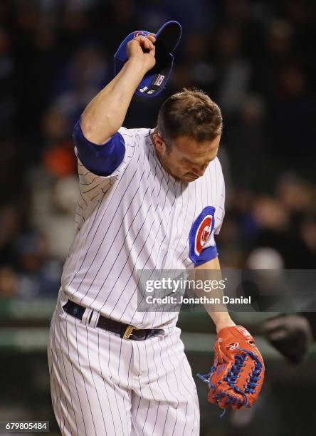 Miguel Montero of the Chicago Cubs, normally a back-up catcher,tips his hat to the crowd after pitching scoreless 9th inning against the New York...