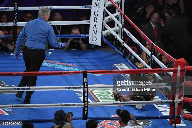 Referee Jay Nady gives a count to Emmanuel Taylor after he was knocked down by Lucas Matthysse in the fifth round of their welterweight bout at...