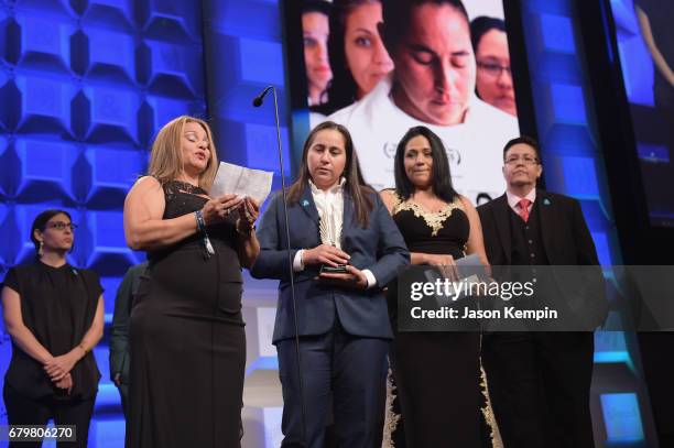 Elizabeth Ramirez, Anna Vasquez, Cassandra Rivera and Kristie Mayhugh accept an award onstage during the 28th Annual GLAAD Media Awards at The Hilton...