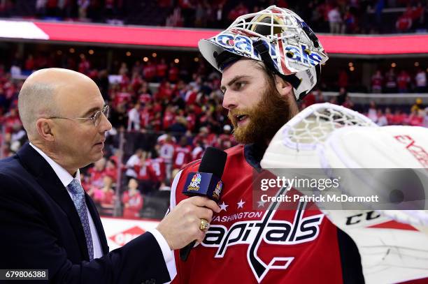 Braden Holtby of the Washington Capitals is interviewed by NBC analyst Pierre McGuire after the Capitals defeated the Pittsburgh Penguins 4-2 in Game...