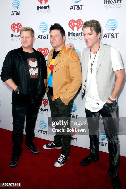 Singer Gary LeVox and musicians Jay DeMarcus and Joe Don Rooney of Rascal Flatts attend the 2017 iHeartCountry Festival, A Music Experience by AT&T...