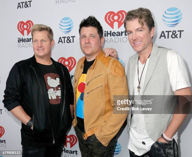 Singer Gary LeVox and musicians Jay DeMarcus and Joe Don Rooney of Rascal Flatts attend the 2017 iHeartCountry Festival, A Music Experience by AT&T...