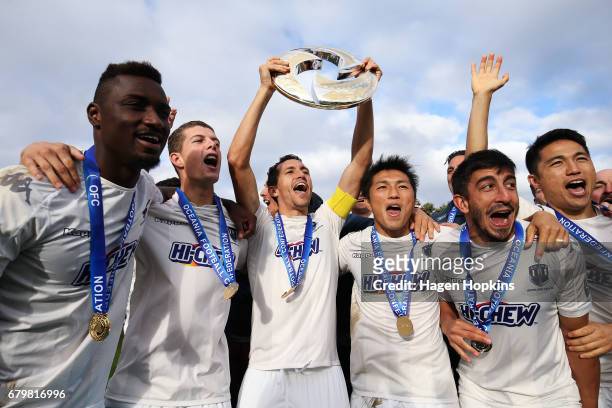 Captain Angel Berlanga of Auckland City celebrates with teammates after winning the OFC Champions League Final match between Team Wellington and...
