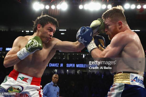 Julio Cesar Chavez Jr. Punches Canelo Alvarez during their catchweight bout at T-Mobile Arena on May 6, 2017 in Las Vegas, Nevada.