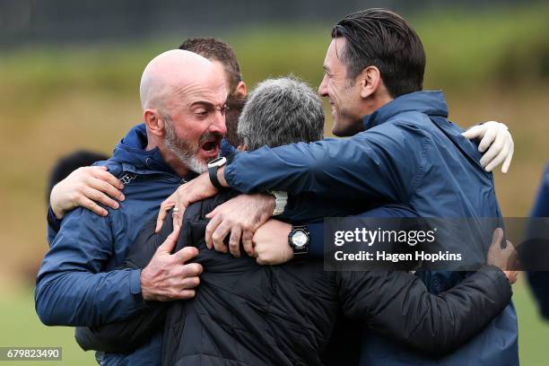 To R, Goalkeeper coach Simone Naddi, coach Ramon Tribulietx and assistant coach Ivan Vicelich of Auckland City celebrate after winning the OFC...