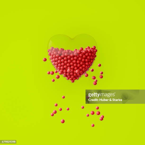 heart with lots of red spheres, some are outside - kreativität stock pictures, royalty-free photos & images