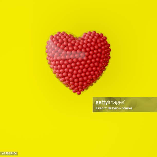 heart with lots of red spheres - kreativität stockfoto's en -beelden