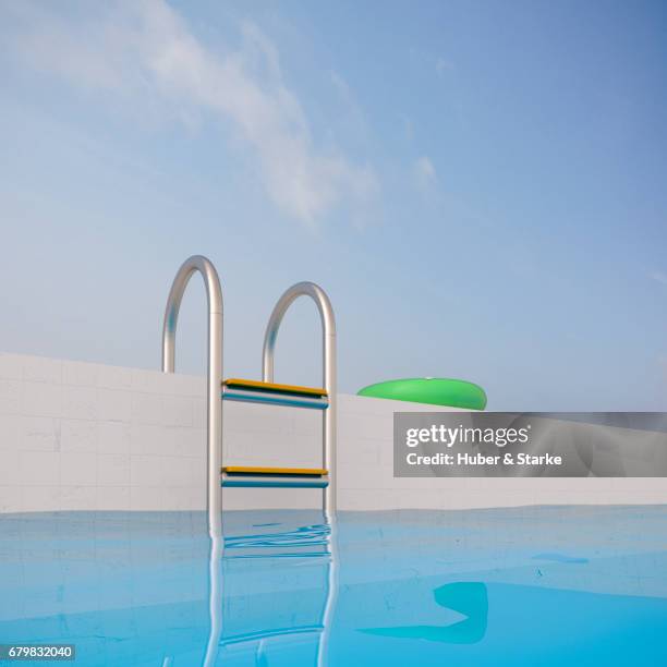 swimming pool, ladder and floating tire - schwimmbecken stock pictures, royalty-free photos & images