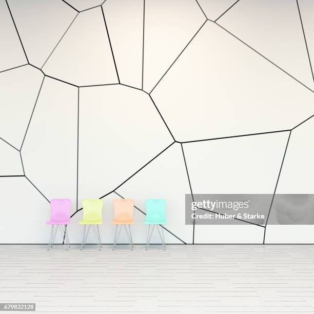 row of seats in front of modern wall - abwarten stockfoto's en -beelden