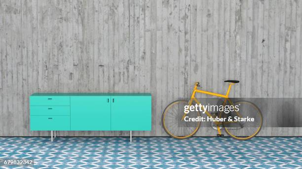 modern sideboard, bike leaning against concrete wall - individualität stock pictures, royalty-free photos & images