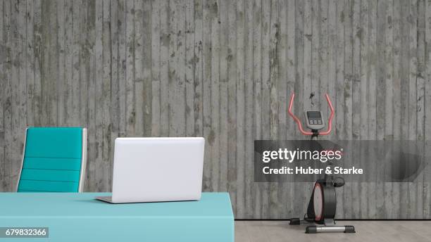 modern sideboard, exercise bike in background - geschäftsleben bildbanksfoton och bilder