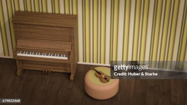 piano and violin in front of old fashioned wallpaper - kreativität stockfoto's en -beelden