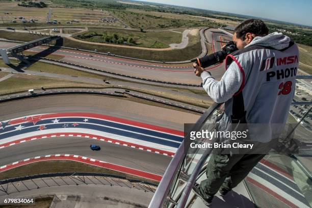 Photographer covers the action from an observation tower during the Advance Auto Parts Sportscar Showdown at Circuit of The Americas on May 6, 2017...