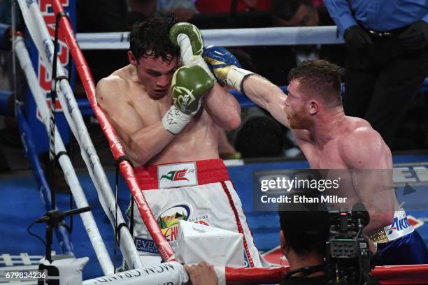 Canelo Alvarez punches Julio Cesar Chavez Jr. During their catchweight bout at T-Mobile Arena on May 6, 2017 in Las Vegas, Nevada. Alvarez won by...