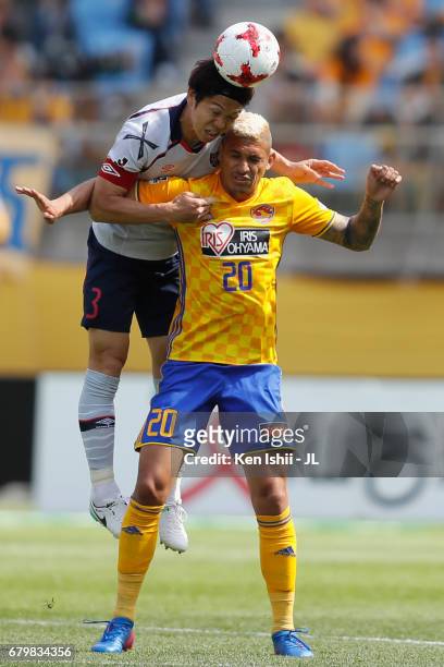 Masato Morishige of FC Tokyo and Crislan of Vegalta Sendai compete for the ball during the J.League J1 match between Vegalta Sendai and FC Tokyo at...