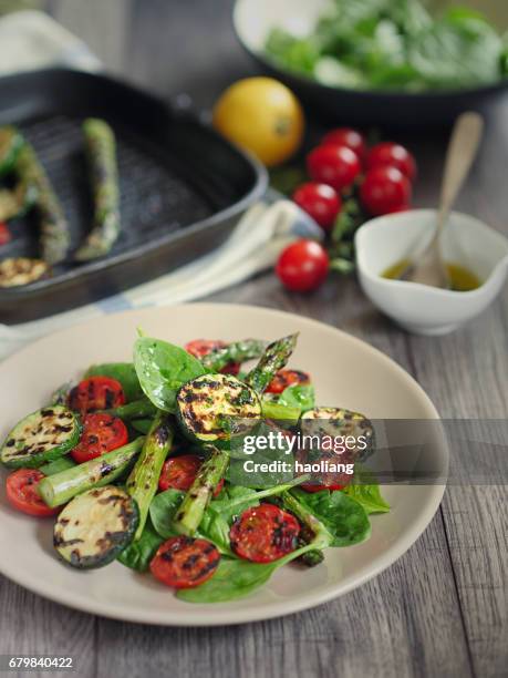 grilled asparagus,courgette and cherry tomatoes salad - griddle stock pictures, royalty-free photos & images