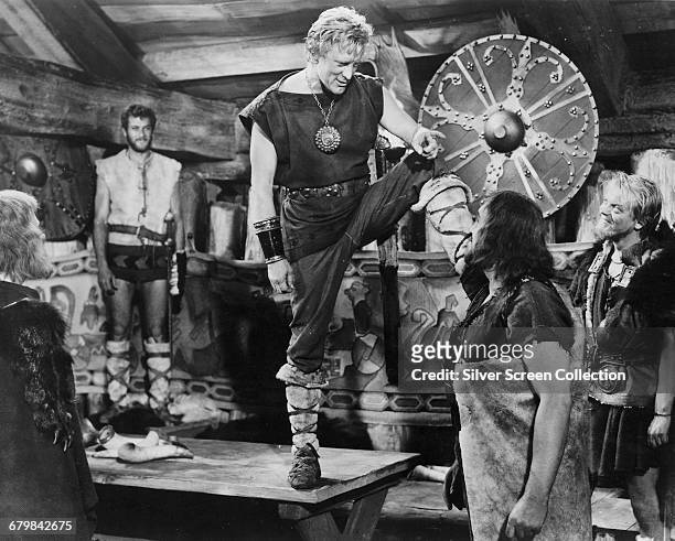 American actors Tony Curtis as Erik and Kirk Douglas as Einar in the adventure film 'The Vikings', 1958.