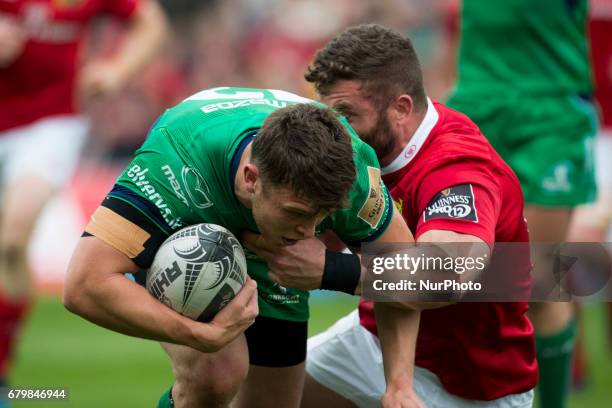 Tom Farrell of Connacht tackled by Jaco Taute of Munster during the Guinness PRO12 rugby match between Munster Rugby and Connacht Rugby at Thomond...