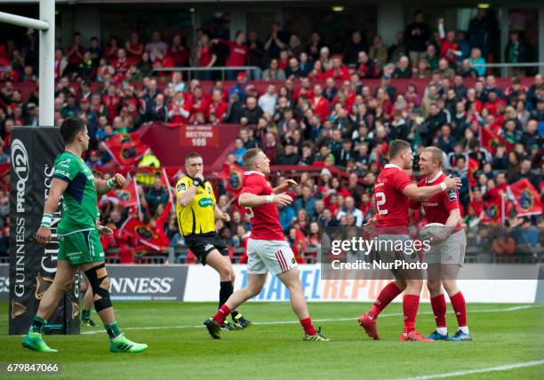 Munster players celebrate after score during the Guinness PRO12 rugby match between Munster Rugby and Connacht Rugby at Thomond Park Stadium in...