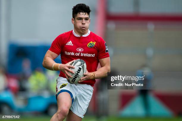 Alex Wootton of Munster runs with the ball during the Guinness PRO12 rugby match between Munster Rugby and Connacht Rugby at Thomond Park Stadium in...