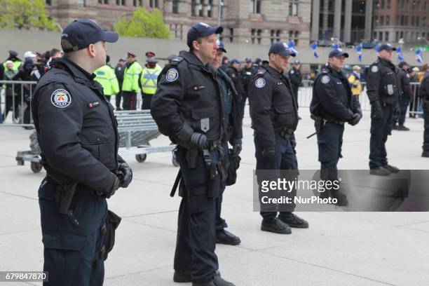 Police stand guard during a rally against Islam, Muslims, and Sharia Law in downtown Toronto, Ontario, Canada, on May 06, 2017. Groups such as the...