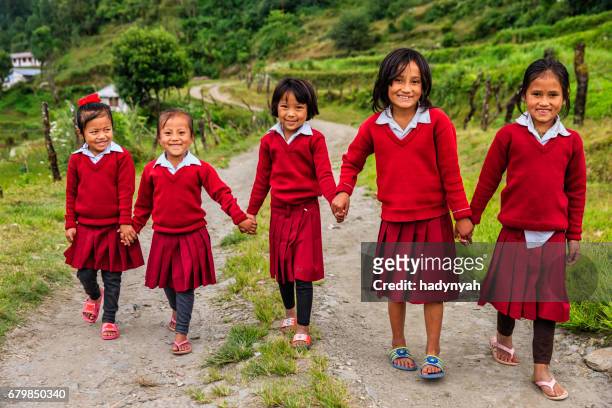 nepali schoolgirls  in village near annapurna range - nepal child stock pictures, royalty-free photos & images
