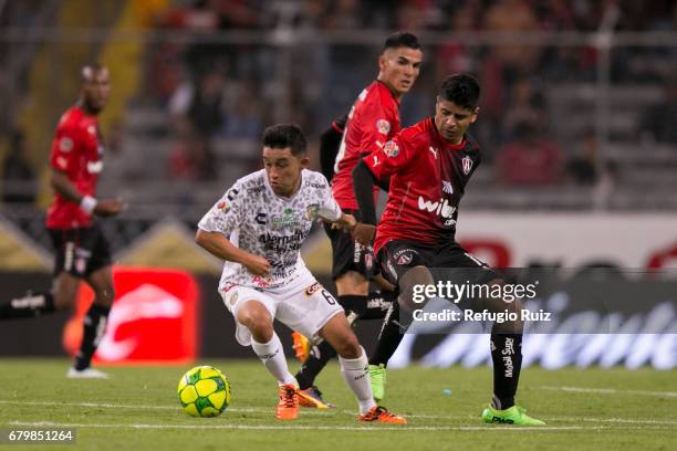 Christian Bermudez of Chiapas fights for the ball with Luis Robles of Atlas during the 17th round match between Atlas and Chiapas as part of the...
