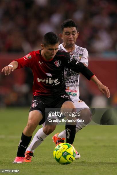 Bryan Garnica of Atlas fights for the ball with Christian Bermudez of Chiapas during the 17th round match between Atlas and Chiapas as part of the...