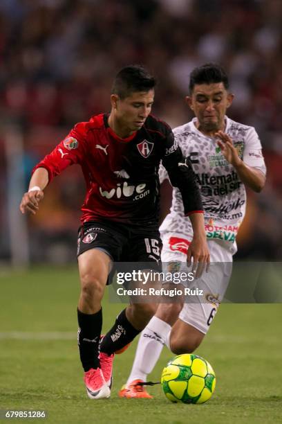 Bryan Garnica of Atlas fights for the ball with Christian Bermudez of Chiapas during the 17th round match between Atlas and Chiapas as part of the...