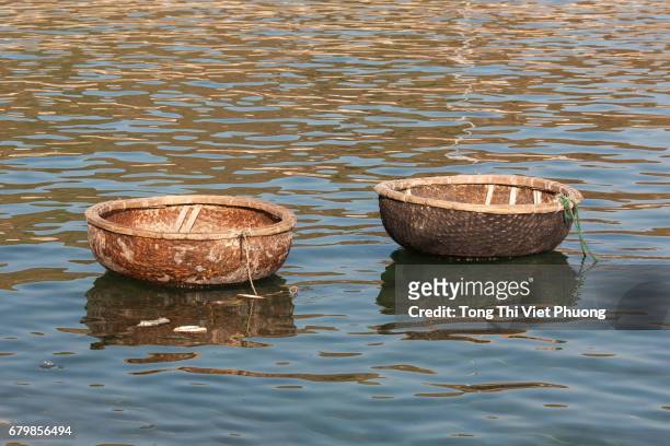 couple basket boats at binh ba island, cam ranh city, khanh hoa province, vietnam. cam ranh has famous military ports - ranh stock pictures, royalty-free photos & images
