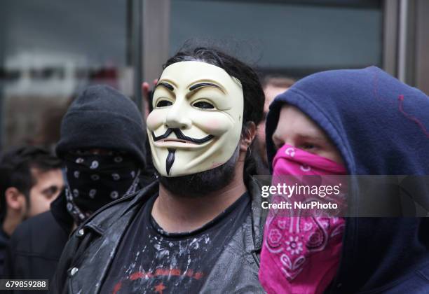 Protestor wearing a Guy Fawkes mask during a rally against Islamophobia, White Supremacy &amp; Fascism in downtown Toronto, Ontario, Canada, on May...