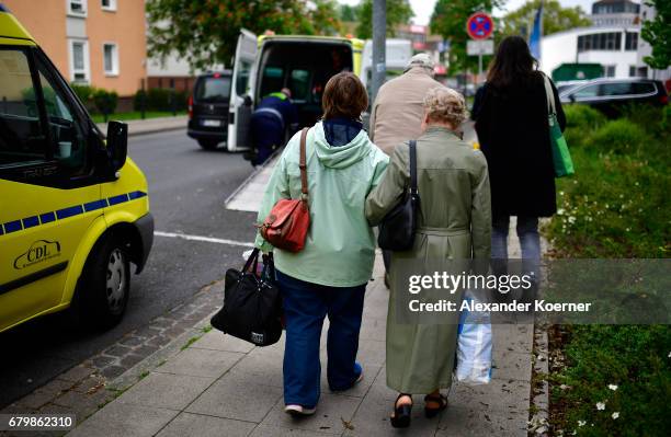 Elderly people from a senior care facility wait to board a bus as part of the evacuation of 50,000 people on May 7, 2017 in Hanover, Germany. Bomb...