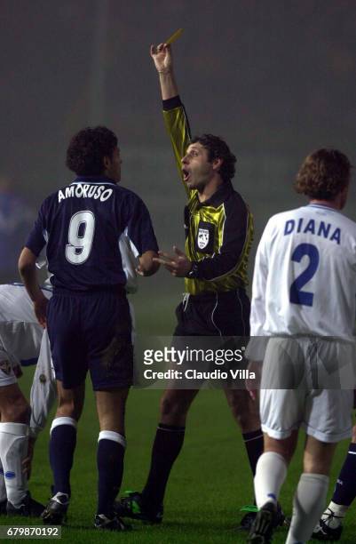 Referee Cosimo BOLOGNINO shows to Nicola AMORUSO of NAPOLI the yellow card during the SERIE A 10th Round League match between BRESCIA and NAPOLI...