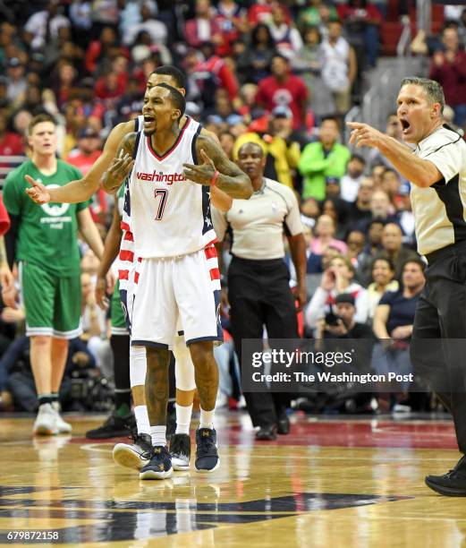 Referee Monty McCutchen throws Washington Wizards guard Brandon Jennings out of the game against the Boston Celtics during game three of the Eastern...