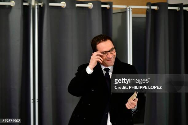 Former French Socialist party candidate Benoit Hamon smiles as he exits a polling booth before casting his ballot at a polling station in Trappes,...
