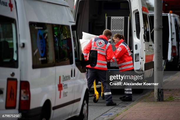 Elderly people from a senior care facility wait to board a bus as part of the evacuation of 50,000 people on May 7, 2017 in Hanover, Germany. Bomb...