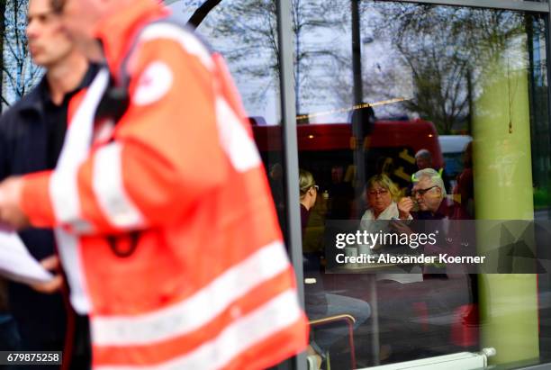 Guests sit inside a hotel during breakfast while part of the evacuation of 50,000 people on May 7, 2017 in Hanover, Germany. Bomb disposal experts...