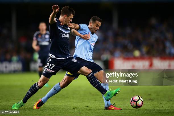 Bobo of Sydney FC is challenged by James Donachie of Melbourne Victory during the 2017 A-League Grand Final match between Sydney FC and the Melbourne...