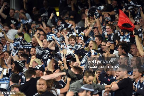 Melbourne Victory fans celebrate the team's first goal against Sydney FC during the 2017 A-League Grand Final match at Allianz Stadium in Sydney on...