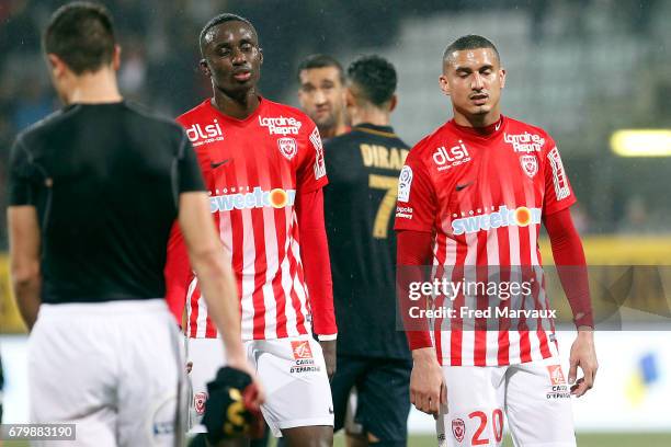 Modou Diagne of Nancy and Michael Chretien of Nancy look dejected at the end of the game during the Ligue 1 match between As Nancy Lorraine and As...