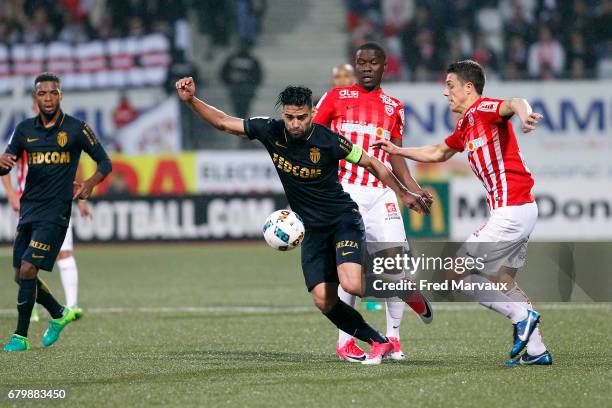 Radamel Falcao of Monaco and Joffrey Cuffaut of Nancy during the Ligue 1 match between As Nancy Lorraine and As Monaco at Stade Marcel Picot on May...