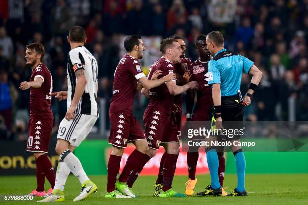 Players of Torino FC complaint with the referee Paolo Valeri after the expulsion of Afriyie Acquah during the Serie A football match between Juventus...